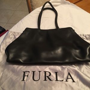 Italian leather hand bag with red lining